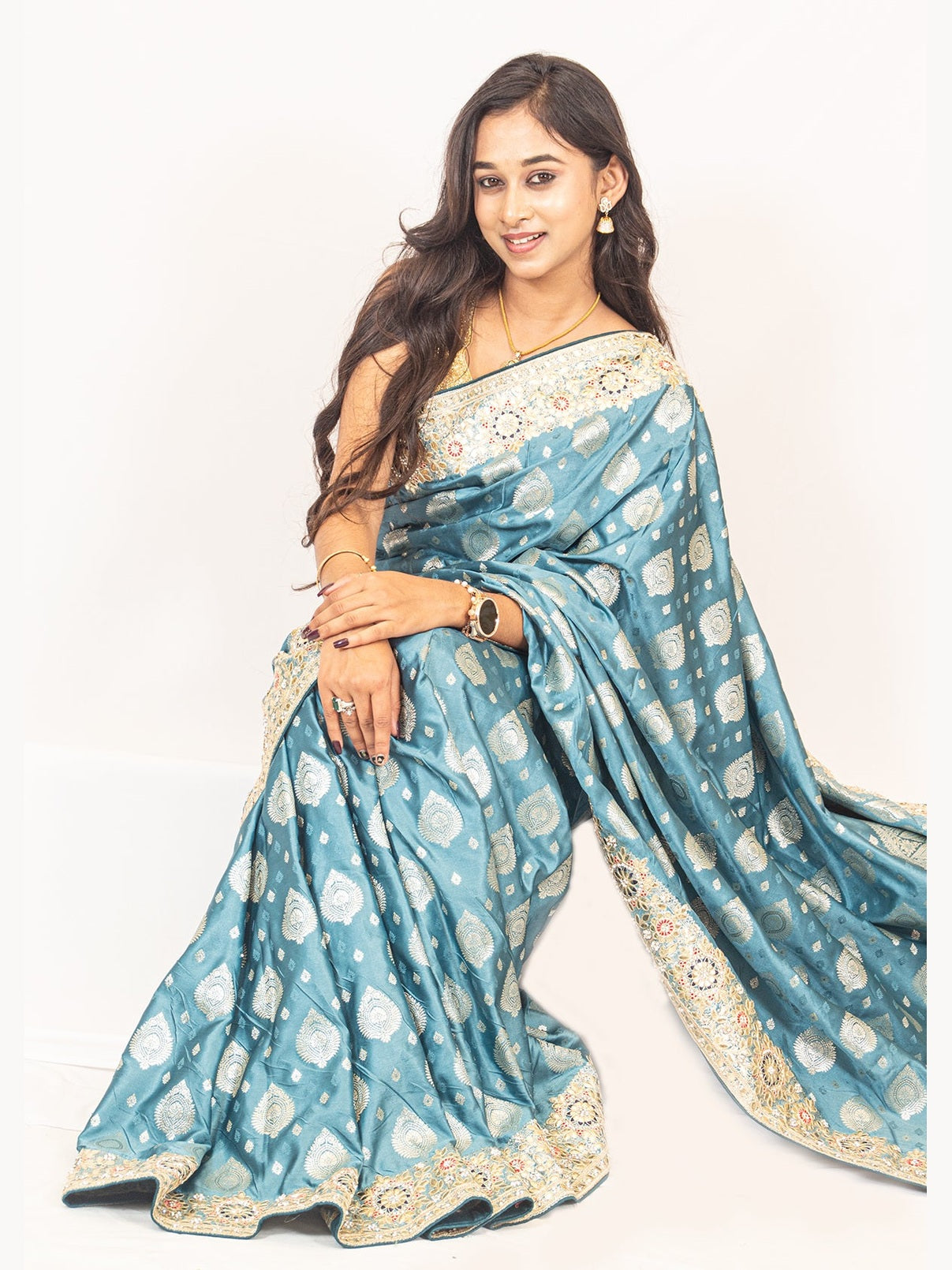 Luxurious Grace Blue Raw Silk Saree with Golden Zari and Stone Detailing
