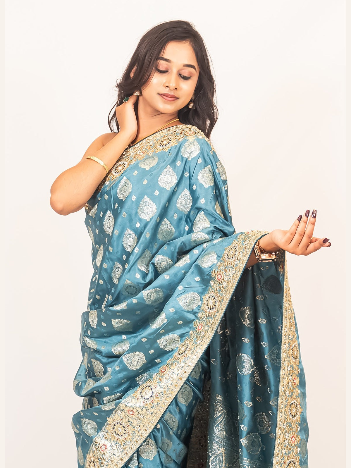 Luxurious Grace Blue Raw Silk Saree with Golden Zari and Stone Detailing