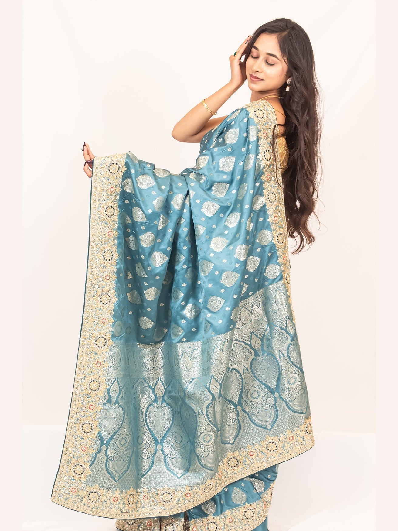 Luxurious Grace Blue Raw Silk Saree with Golden Zari and Stone Detailing