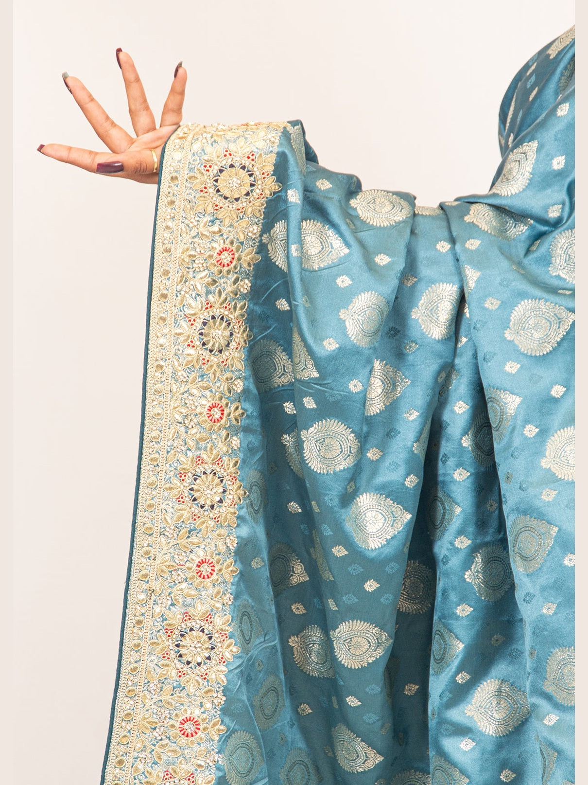 Luxurious Grace Blue Raw Silk Saree with Golden Zari and Stone Detailing