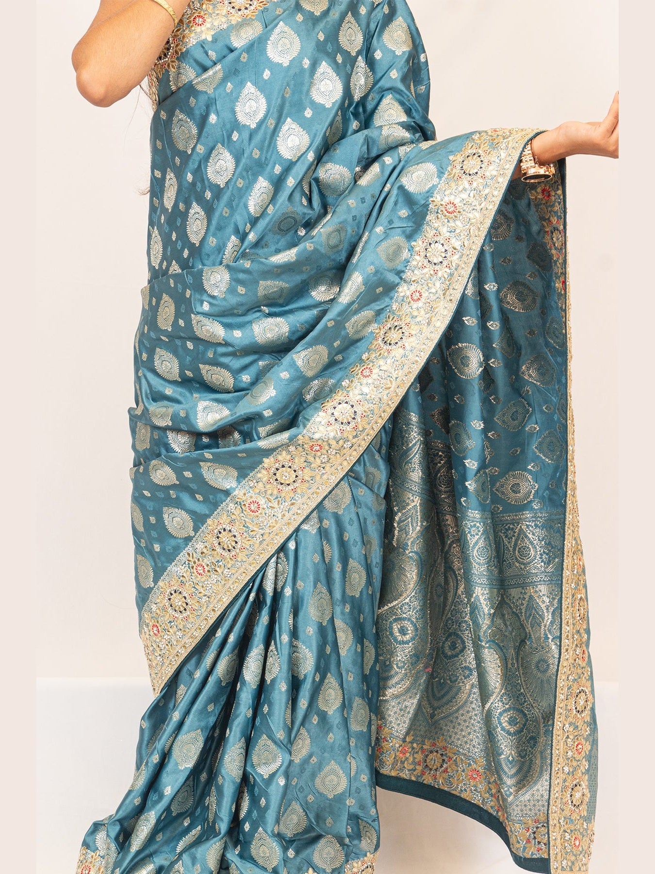 Luxurious Grace Blue Raw Silk Saree with Golden Zari and Stone Detailing