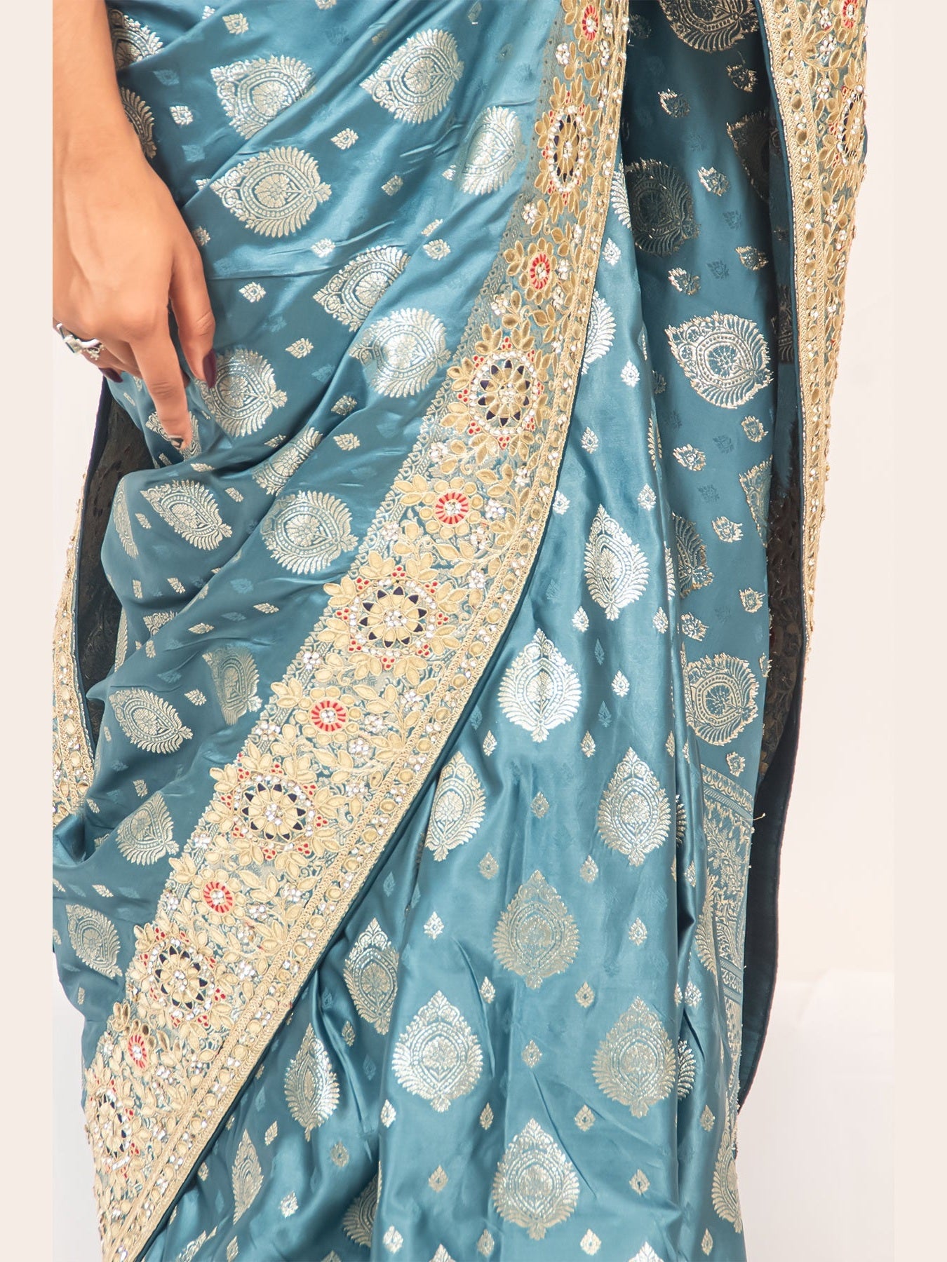 Luxurious Grace Blue Raw Silk Saree with Golden Zari and Stone Detailing