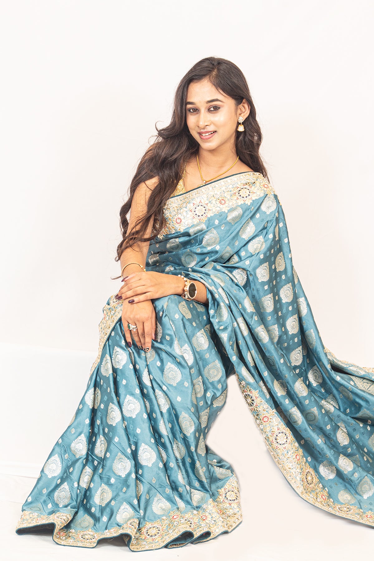 Luxurious Grace Blue Raw Silk Saree with Golden Zari and Stone Detailing