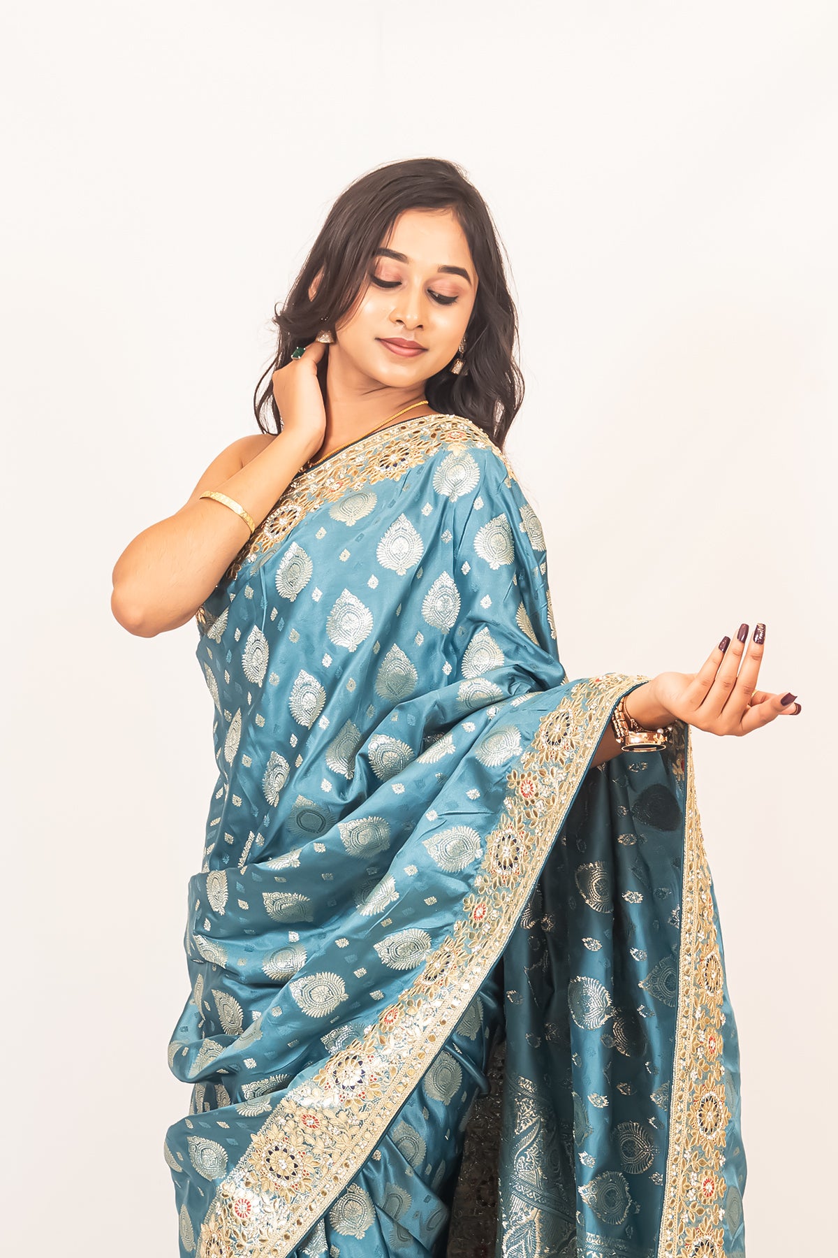 Luxurious Grace Blue Raw Silk Saree with Golden Zari and Stone Detailing