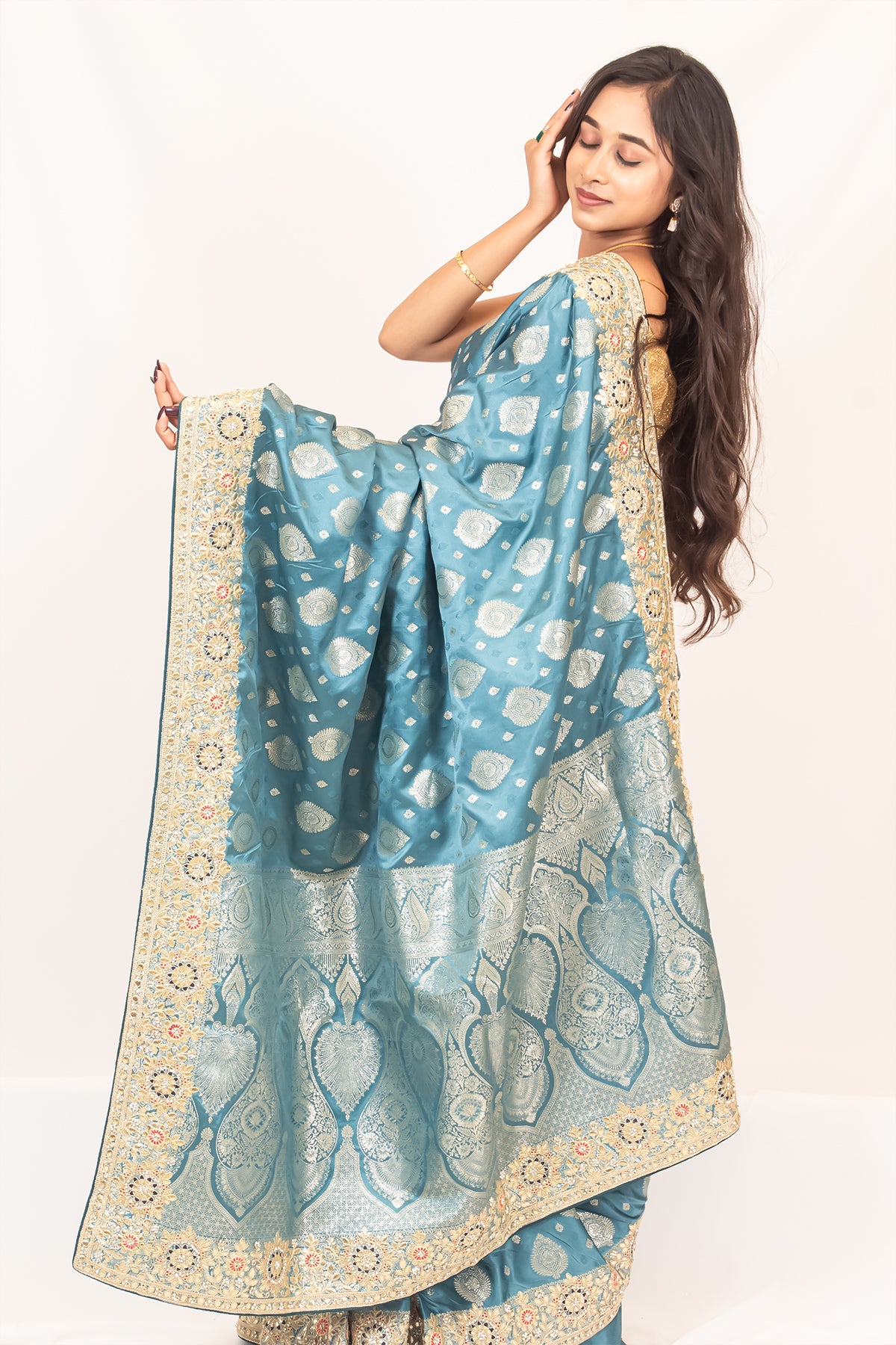 Luxurious Grace Blue Raw Silk Saree with Golden Zari and Stone Detailing