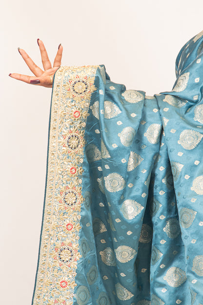 Luxurious Grace Blue Raw Silk Saree with Golden Zari and Stone Detailing