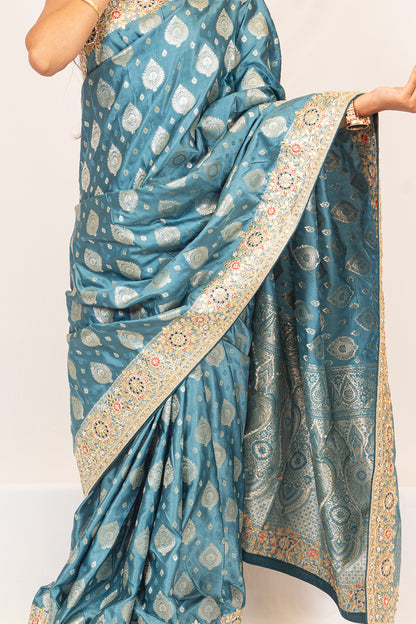 Luxurious Grace Blue Raw Silk Saree with Golden Zari and Stone Detailing